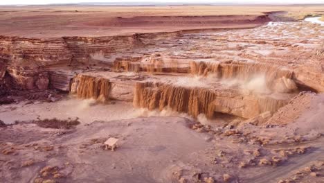 aerial of a drone panning around grand falls also known as chocolate falls