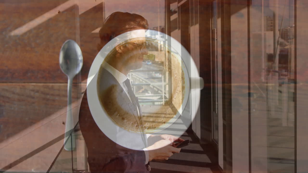 Using smartphone, businessman animated coffee cup and spoon on table