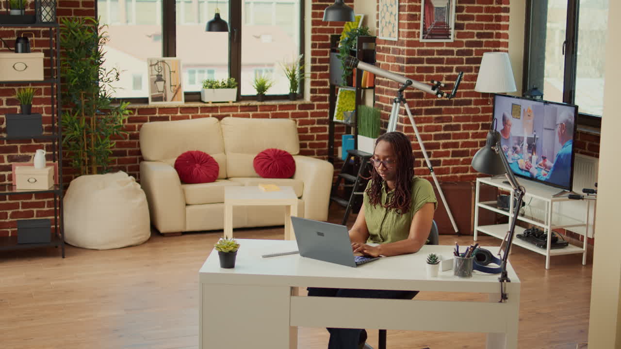 Corporate employee working from home on laptop