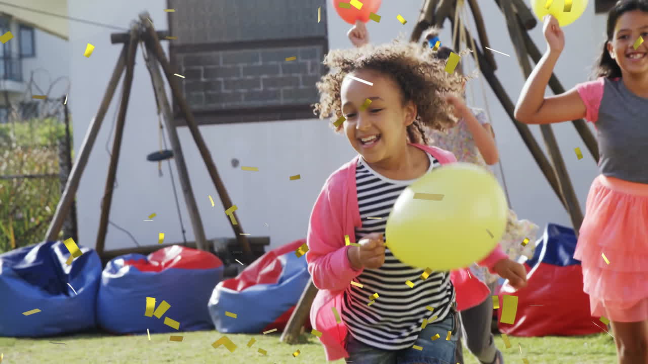 Children playing with ball over falling confetti animation in playground