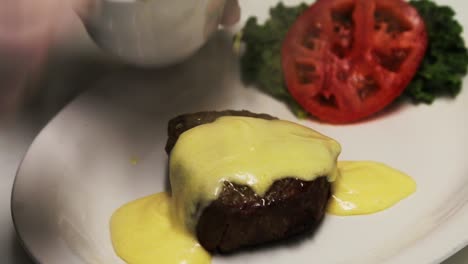 steak dinner being plated in restaurant