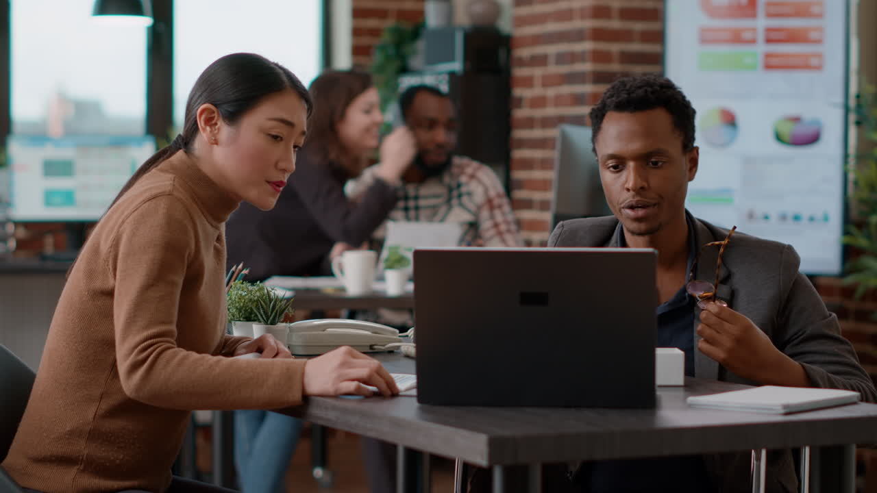 Man and woman doing teamwork to create marketing analysis