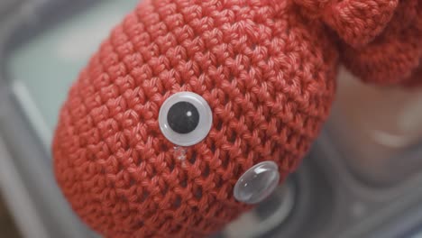 close up of a pink wool octopus