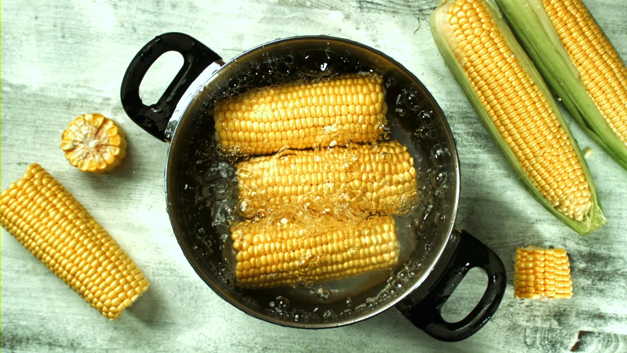 Fresh Corn on the Cob Boiling in a Pot, Top View