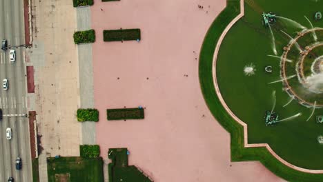 aerial drone shot of a downtown park in chicago featuring a serene fountain