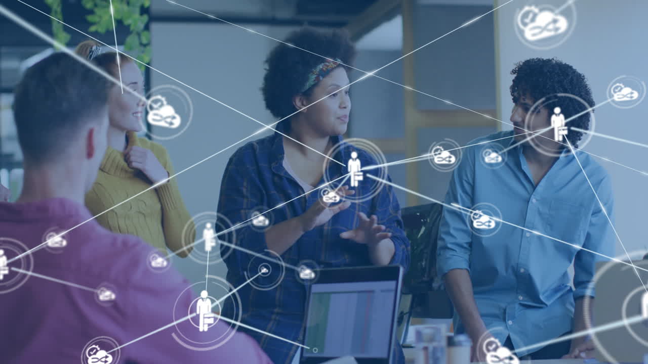 Animation of network of connections with people icons over diverse business people in office