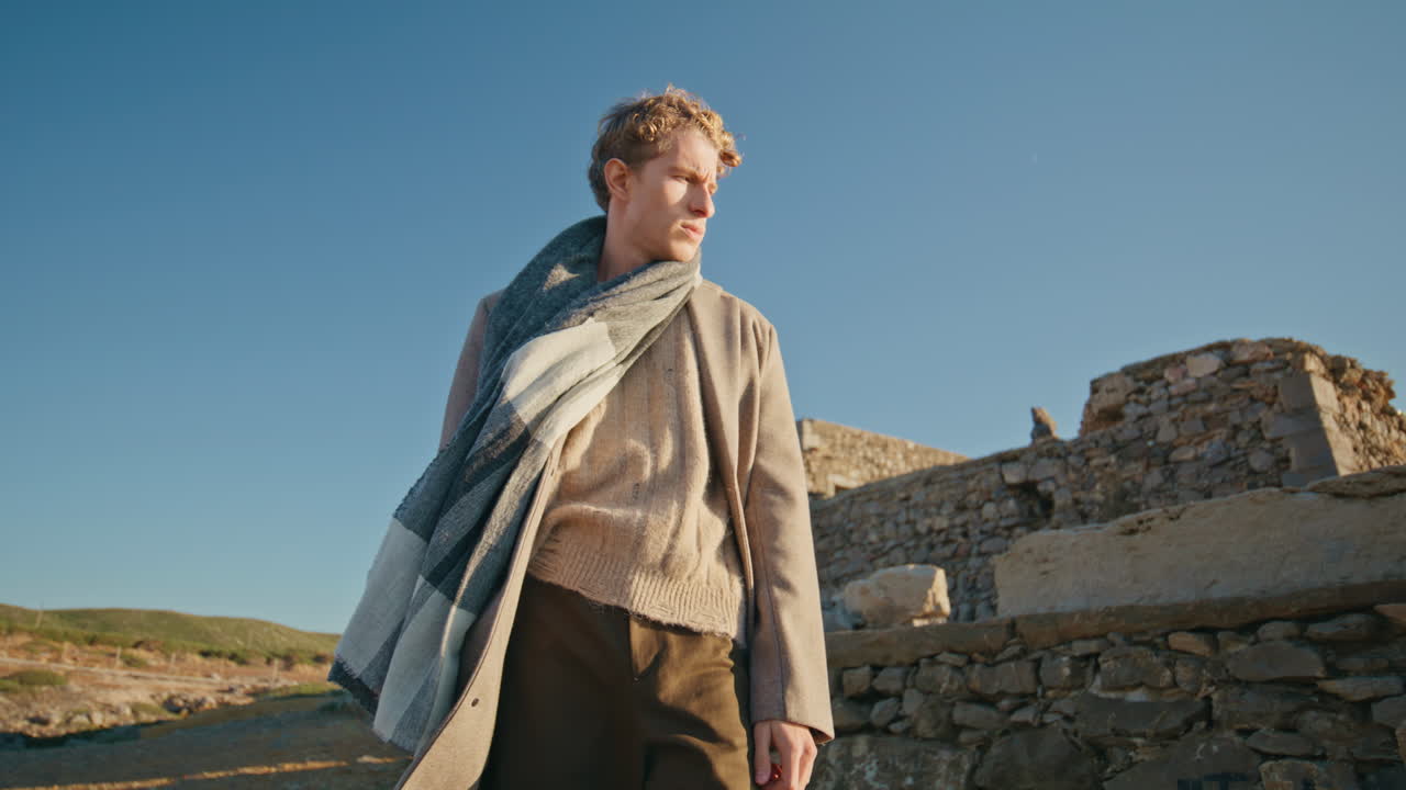 Thoughtful man standing hills closeup. Worried guy contemplating problems cliffs