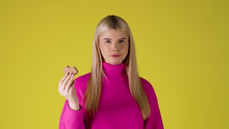 woman eating a heart shaped waffle