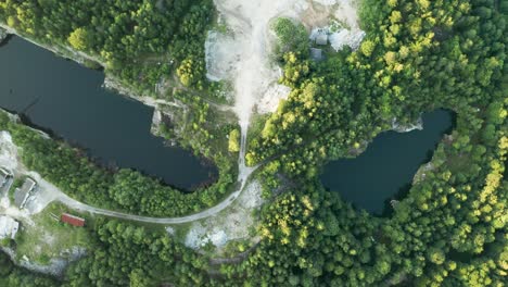 aerial drone zoom in footage of the two lakes in quarry called rampa in czech republic