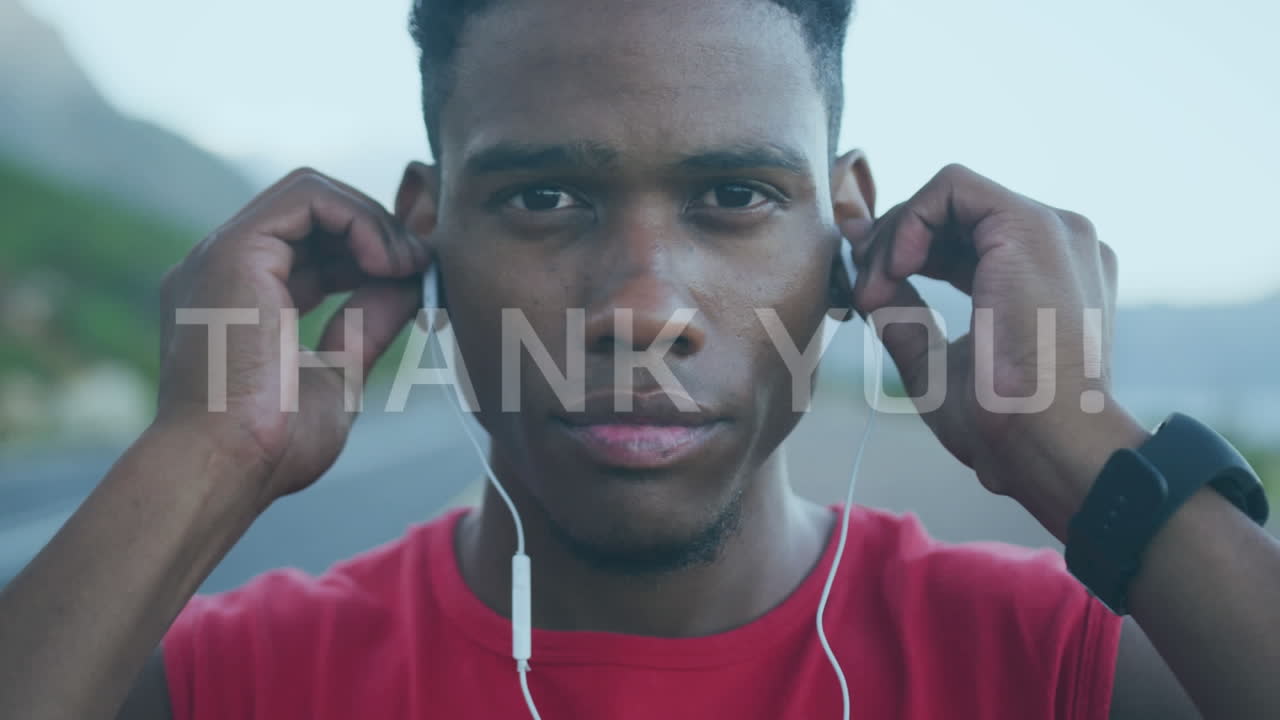 Animation of thank you text over african american male runner wearing earphones