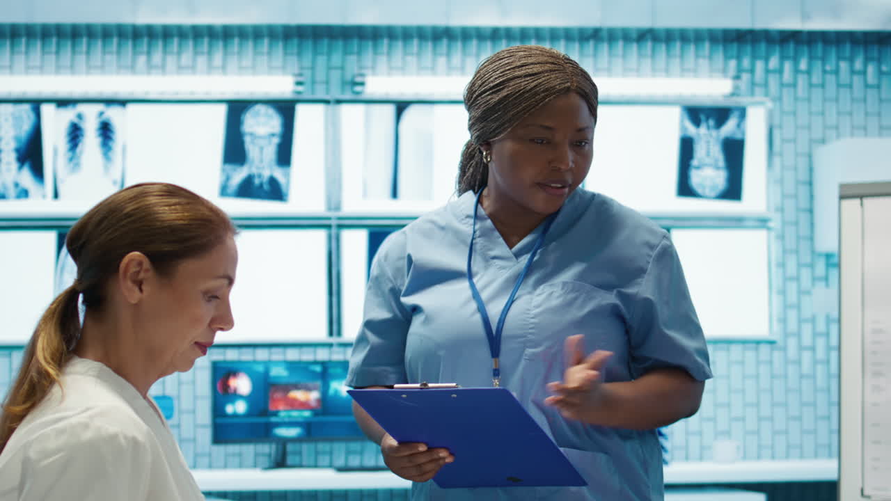 Medical Team Discussing X-rays in Hospital