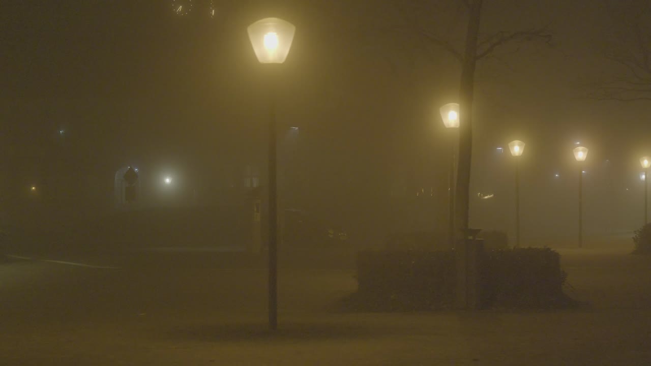 Foggy Night Street with Lampposts