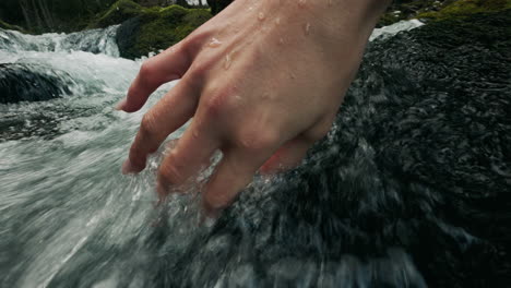 hand in a mountain stream