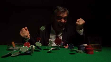 ecstatic gambler cheering as chips rain down