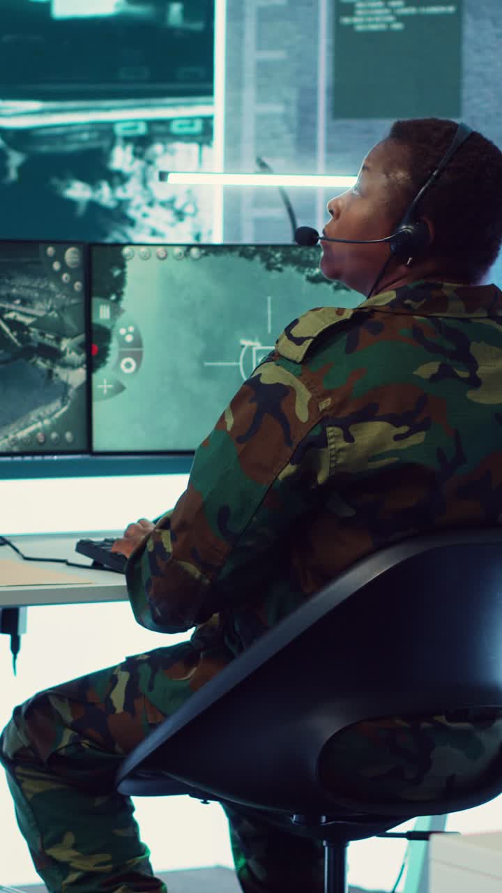 Soldier in Camouflage Uniform Operating Computer in Control Room