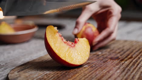 woman cutting a peach