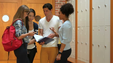 Smiling-students-discussing-in-hallway