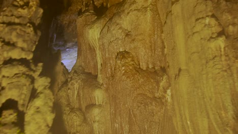 orange lighted stalactite and stalagmite in the largest cave complex son doong in phong nha vietnam