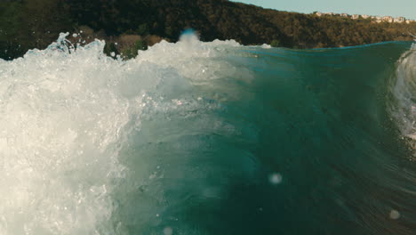 perfect wake surf wave forming in slow motion on serene blue lake water in extreme slow motion