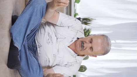 Vertical-video-of-The-meditating-old-man.