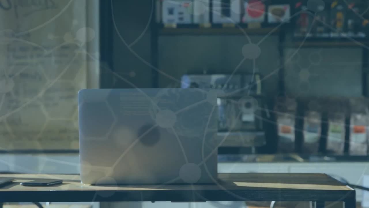 사무실 의 책상 에 놓여 있는 노트북 에 있는 과학적 데이터 의 애니메이션