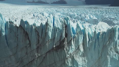 handheld shot of endless spikes of ice on the front of perito moreno glacier