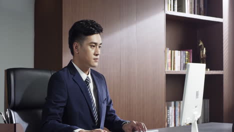 portrait of successful male businessman ceo director entrepreneur in formal suit sitting thinking in office