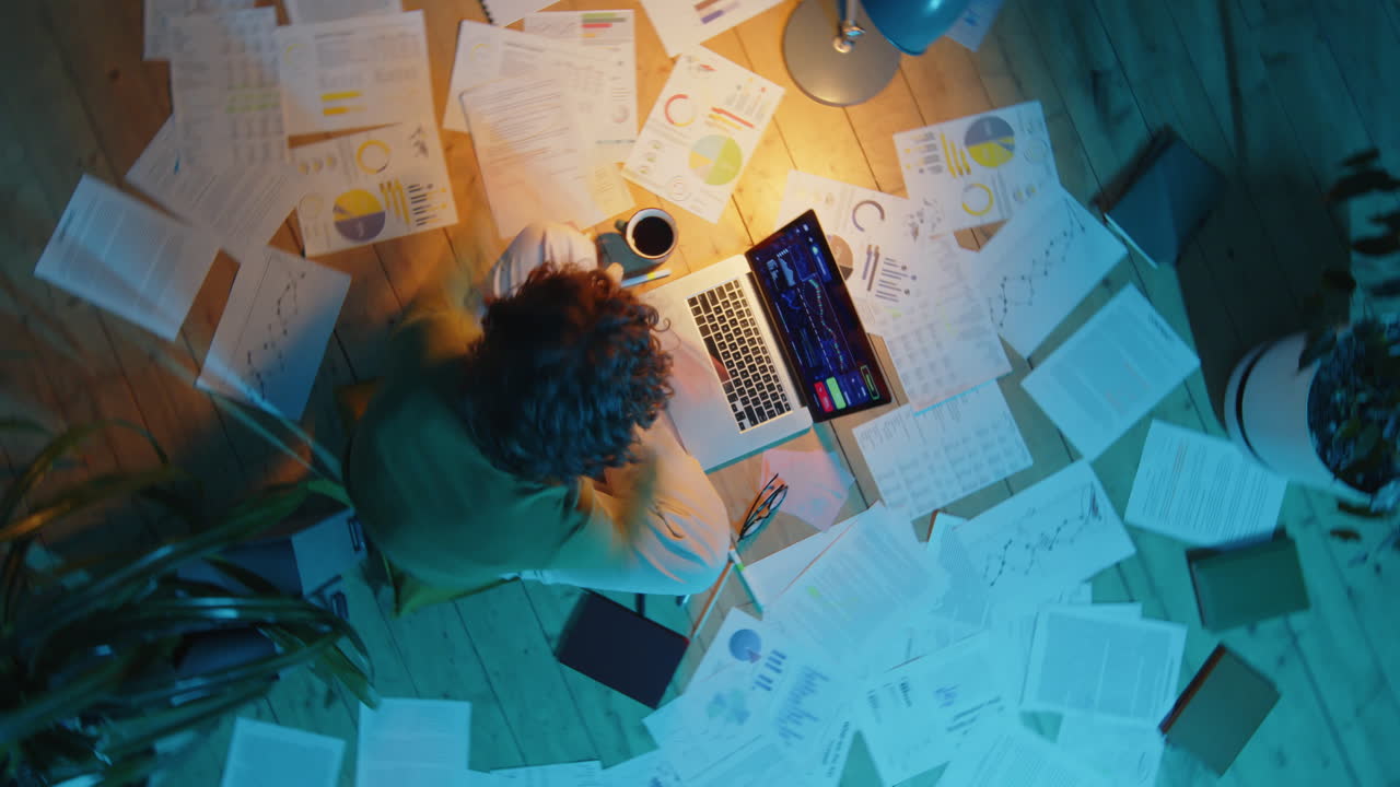 Female Freelancer Working on Investment Plan during Night