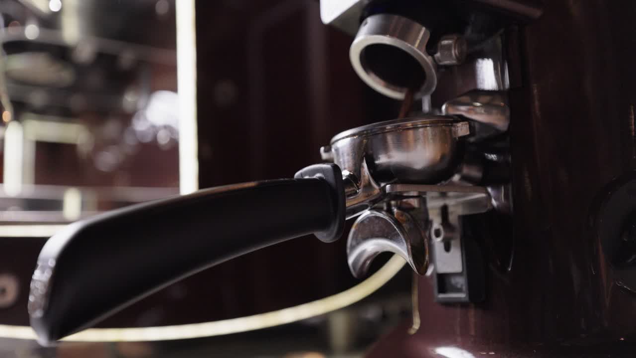 Ground Coffee Beans Pour On The Portafilter With Double Spout. - close up