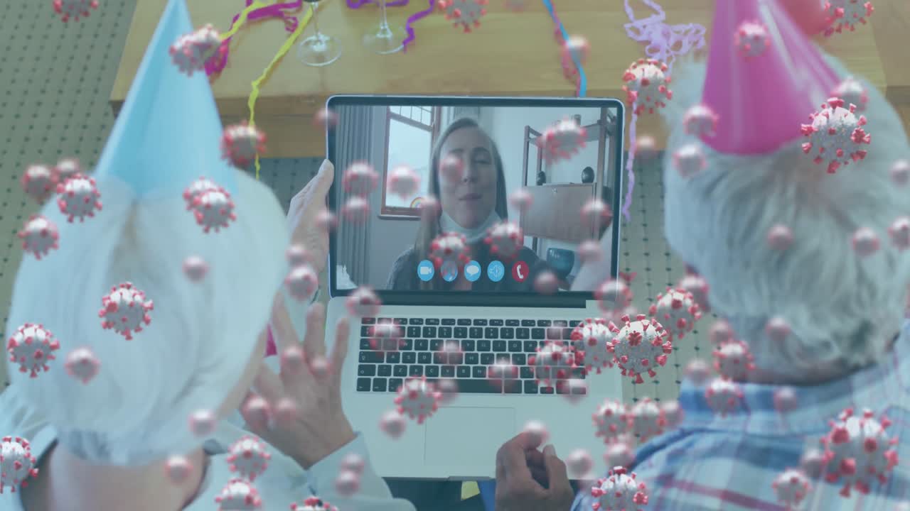 비디오 통화에서 노인 커플이 파티 모자를 입고 노트북을 사용하여 코로나19 세포가 떠다니는 애니메이션