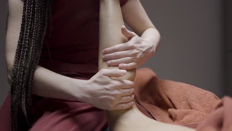 woman receiving a leg massage