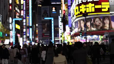 crowded urban street with vibrant neon signs