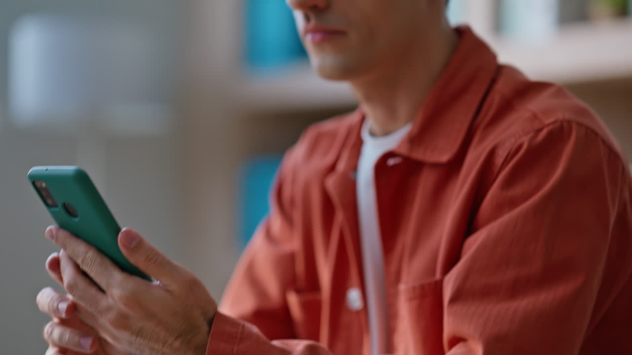 Displeased manager looking cellphone busy of office work closeup. Frustrated man