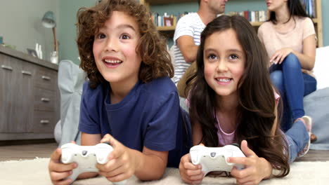 brother and sister playing video games