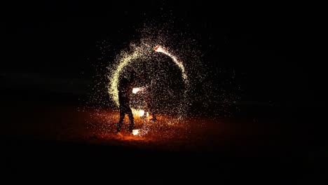 performer displays fire skills on krabi beach