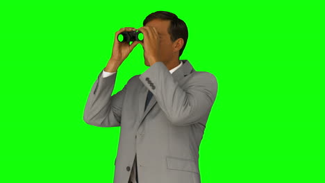 businessman looking through binoculars