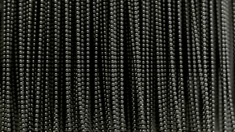 the curtain / wall made of metal balls hanging on the strings creates an ideal background. magnetically attracted metal.