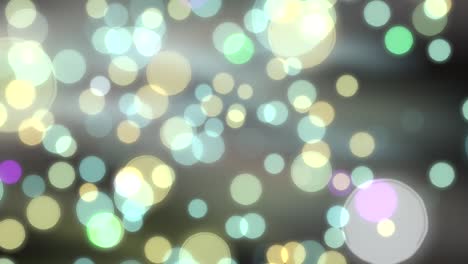 glowing colored bokeh background with floating light particles