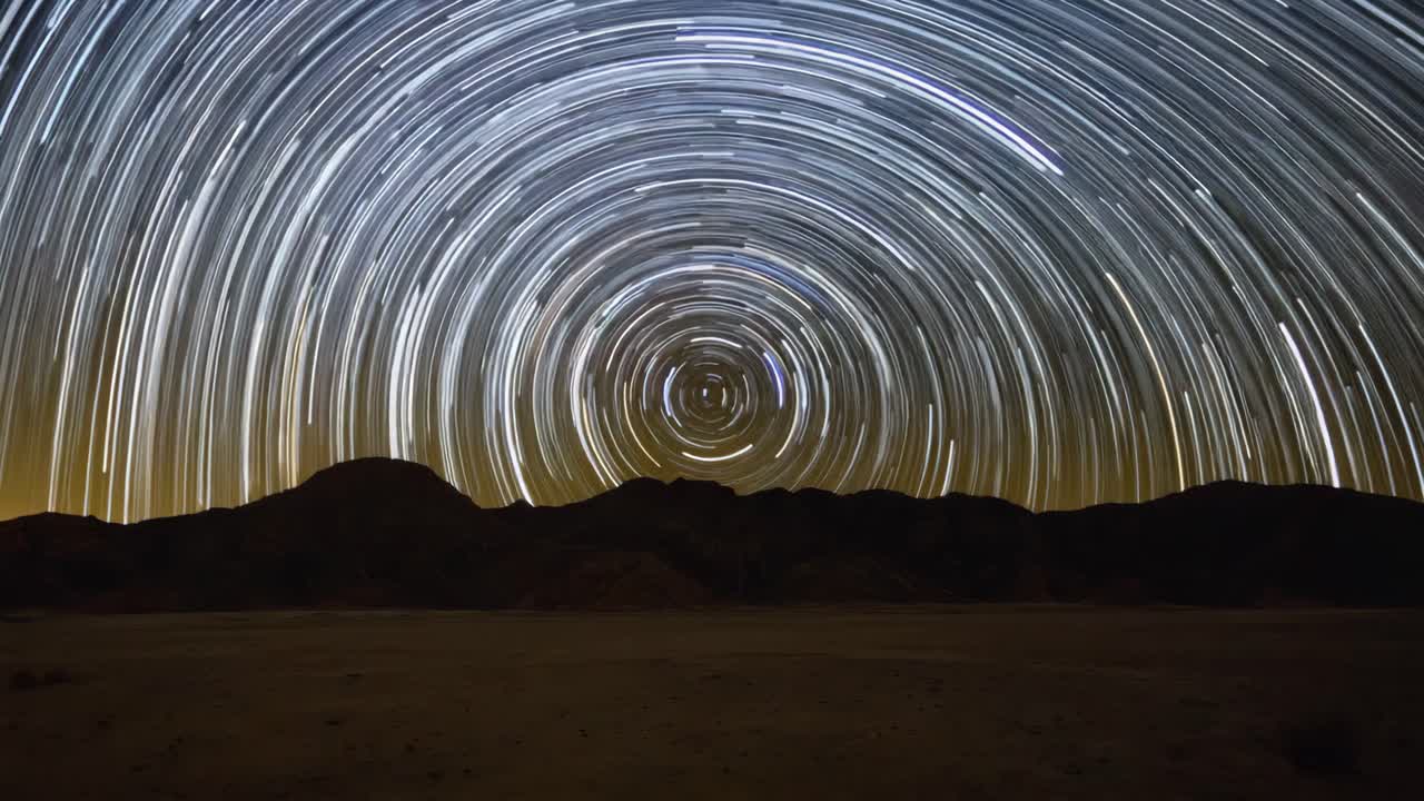 Star Trails Over Desert Mountains