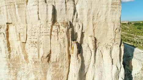 white cliff face with aerial view