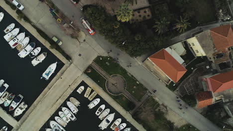 Rotating-Top-View-Over-Boats-And-Fire-Truck-In-Marina,-Split,-Croatia