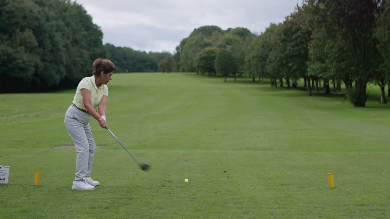 Woman playing golf on a golf course
