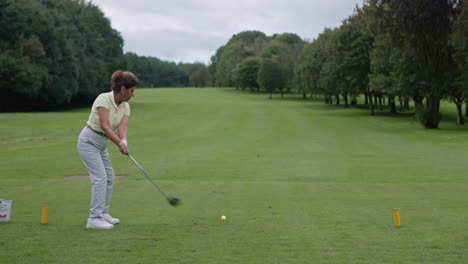 woman playing golf on a golf course