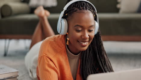 Home,-smile-and-black-woman-with-a-headphones