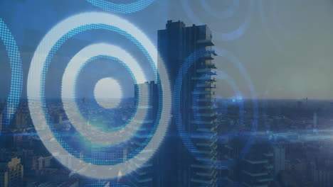 digital blue circles animating over cityscape with tall buildings in view
