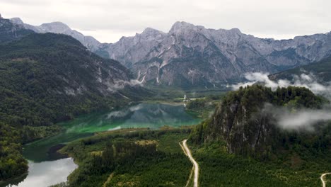 aerial, push in, of almsee lake in the austrian alps