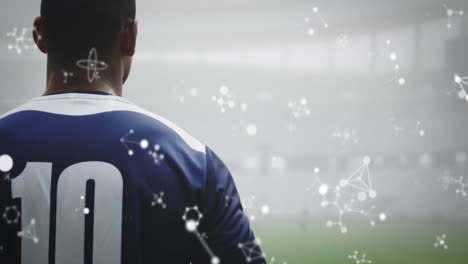 animation of chemical structures over male rugby players at stadium