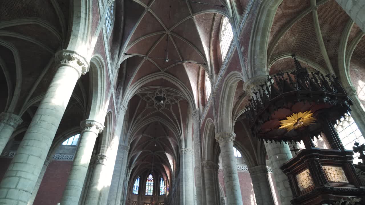 Majestic gothic interior of Saint Michael's Church in Ghent, Belgium, showing arches