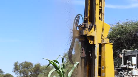 machine drilling water borehole in masai village in loitokitok, kenya