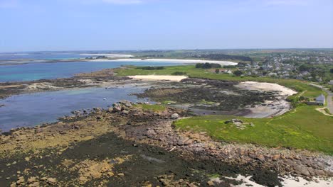 brittany’s coastal landscape near brest, showcasing rocky shores, sandy inlets, and lush green fields. this scene captures the unique, rugged charm of france’s atlantic coastline. drone aerial.